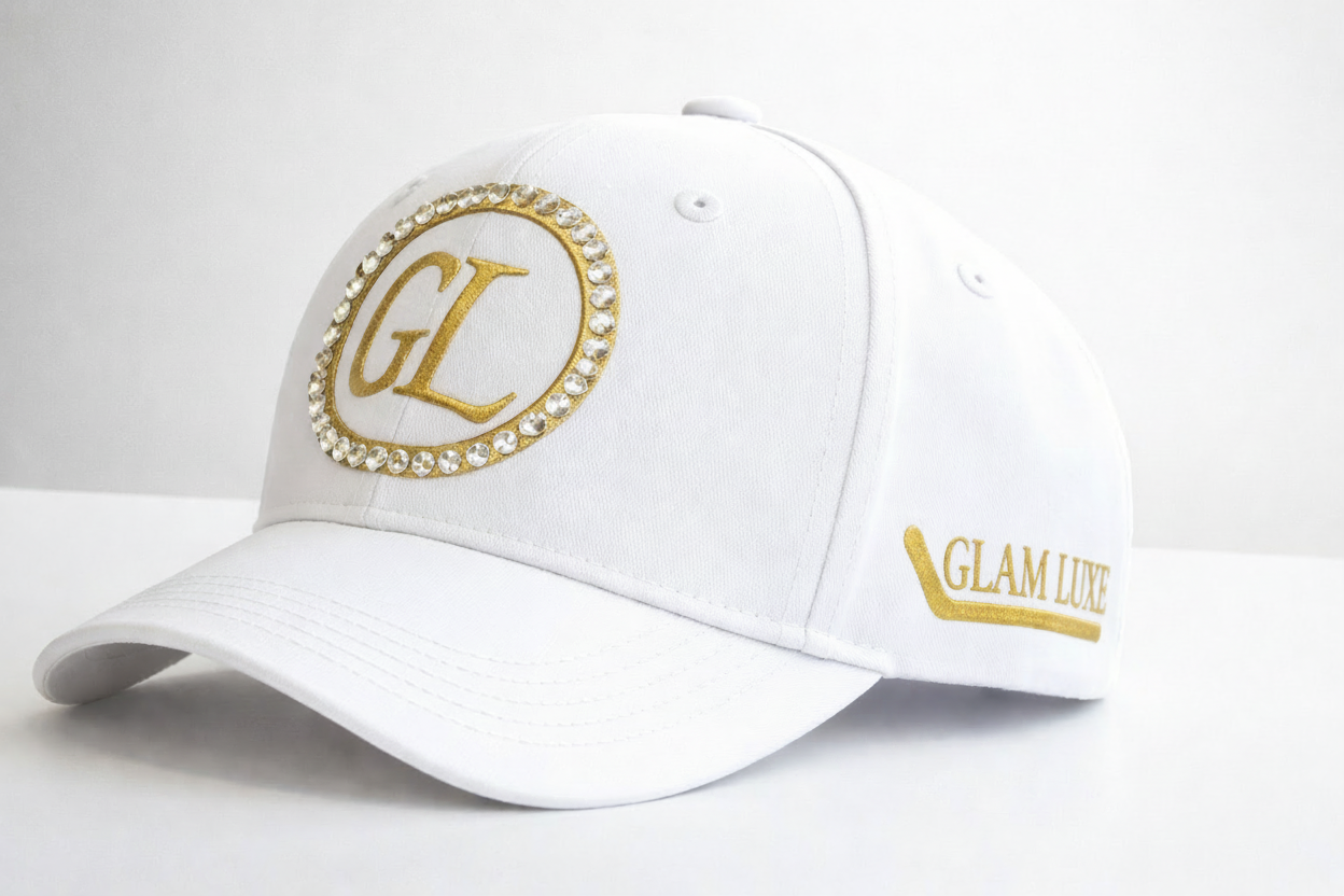 GL cap Glam Luxe Hockey™ Cap in white with glitter gold double rings, rhinestone crystal detail, and large GL centre monogram — adjustable hockey cap by Sparkle & Slapshots
