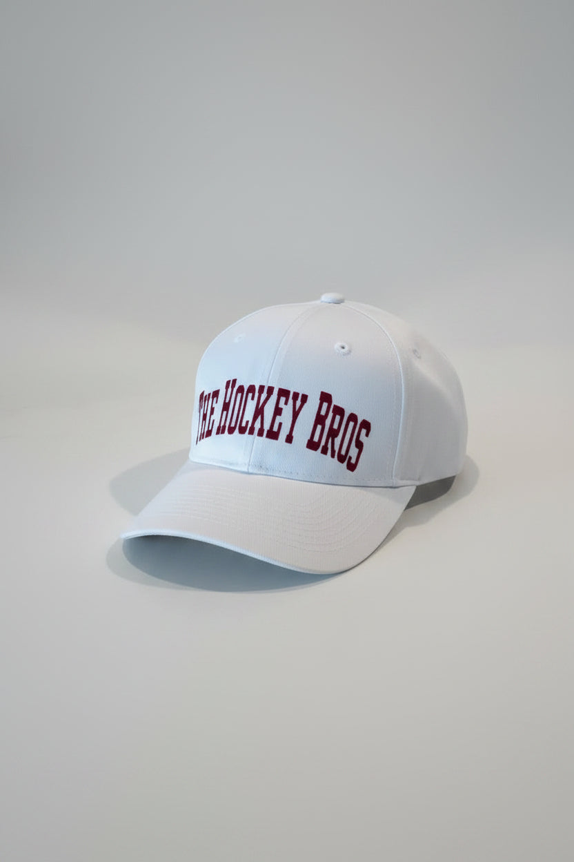 The Hockey Bros™ Classic Edition Cap — youth hockey white cap, adjustable closure, premium red vinyl branding, ships from Canada