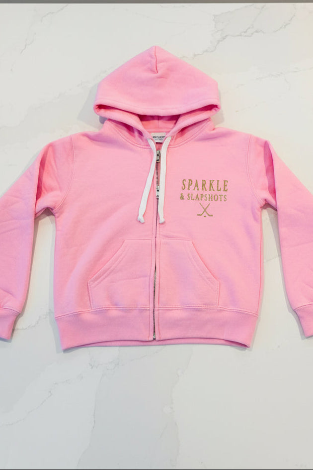 pink zip-up hoodie featuring gold glitter vinyl logo by Sparkle & Slapshots Design Co.