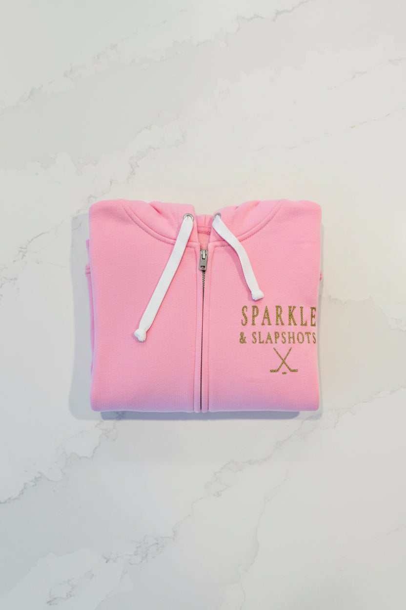 Girls' pink zip-up hoodie with gold glitter Sparkle & Slapshots logo — Made in Canada